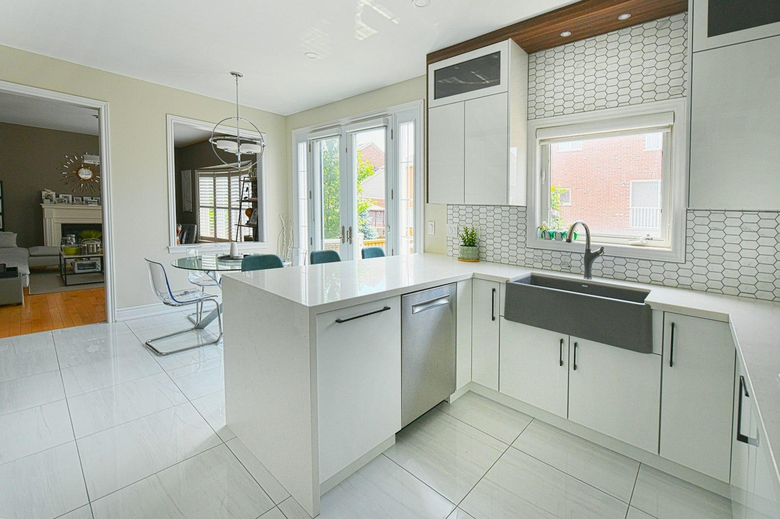 Kitchen with island, farmhouse sink, and fitted cabinets